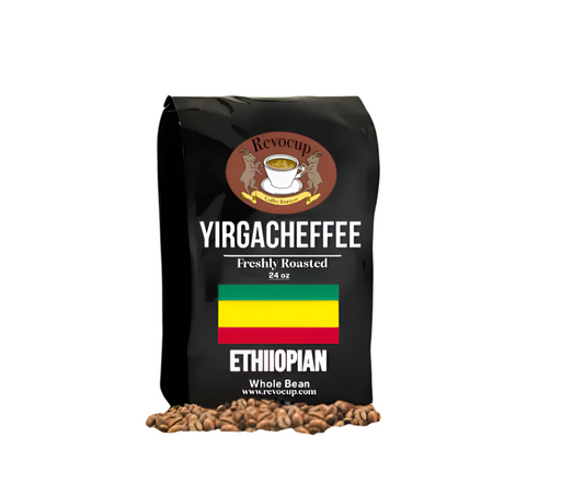 A black bag of Revocup Yirgacheffee Ethiopian Whole Bean coffee, 24 oz, stands upright on a pile of roasted coffee beans.
