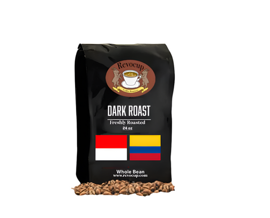 A black bag of Revocup Dark Roast Whole Bean coffee, 24 oz, stands upright on a pile of roasted coffee beans. 