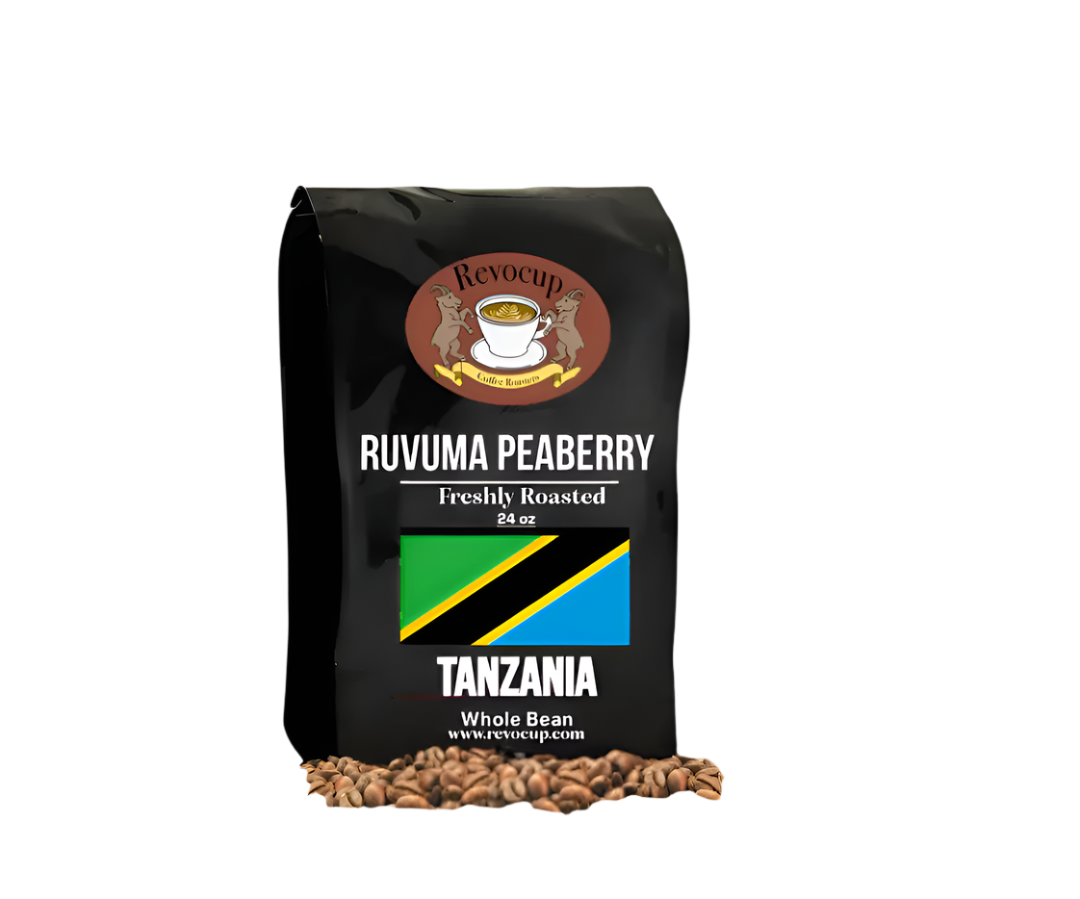  "Revocup Ruvuma Peaberry" coffee bag with the Tanzanian flag on the front, text indicating it is freshly roasted whole bean coffee in a 24 oz size, and coffee beans scattered at the bottom.